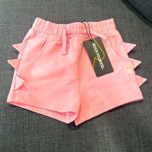 Pink shorts dinosaur side